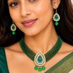 Close-up view of green beaded Kundan necklace pendant with decorative bead drops