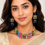 Close-up view of colorful beaded necklace pendant with multicolor stone design