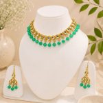 Gold plated Kundan choker with green bead detailing for women
