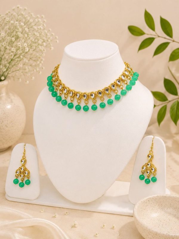 Gold plated Kundan choker with green bead detailing for women