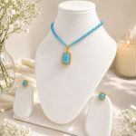 Gold plated sky blue pendant with matching earrings jewellery set