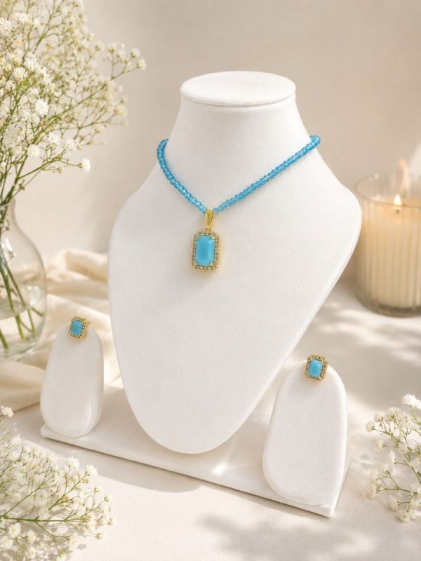 Gold plated sky blue pendant with matching earrings jewellery set