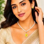 Woman wearing yellow crystal pearl pendant necklace set with matching stud earrings