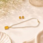 Elegant yellow gemstone pendant necklace set with matching earrings