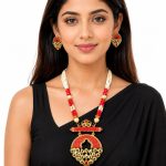 Women wearing Red and white beaded necklace set with Kundan pendant
