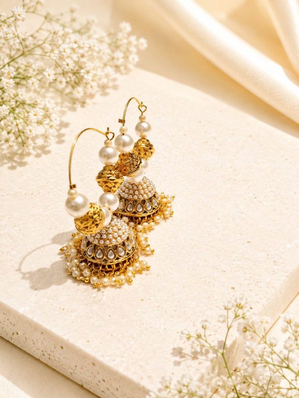 Ethnic gold and pearl jhumka earrings for festive occasions