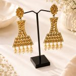 Designer Indian jhumka earrings with gold finish and pearls