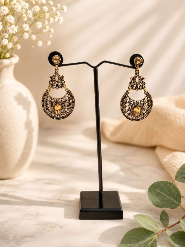 Traditional antique gold earrings with teardrop design