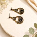 Traditional black stone earrings for women with antique finish-side view on flat