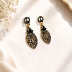 Close-up view of antique black stone earrings for women
