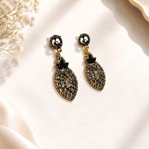Close-up view of antique black stone earrings for women