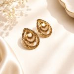 Vintage style antique gold earrings with intricate detailing