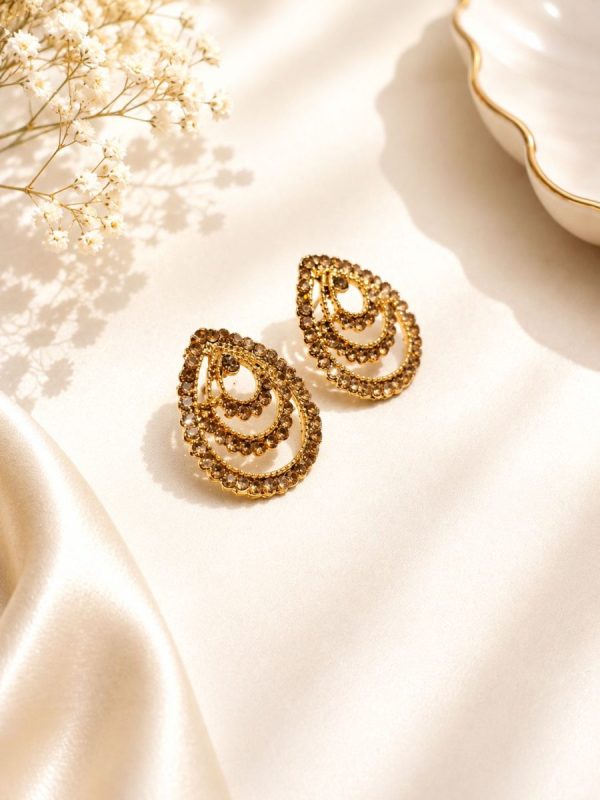 Vintage style antique gold earrings with intricate detailing