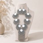 mirror necklace set on white stand front view