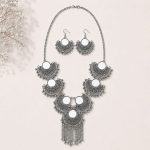 mirror necklace set on flat surface