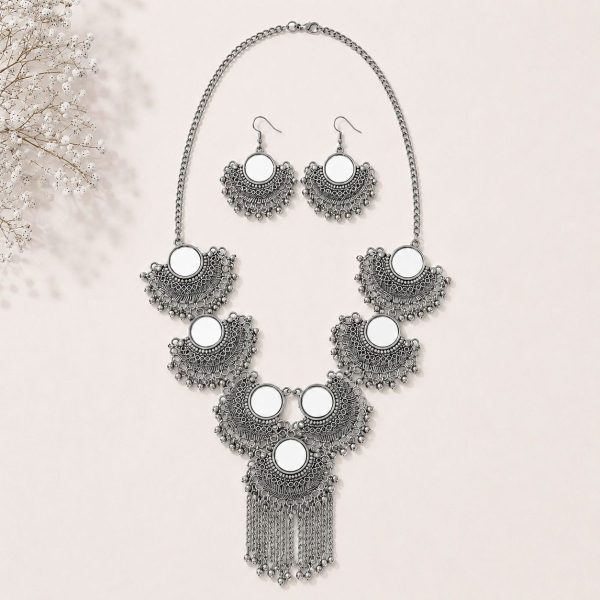 mirror necklace set on flat surface