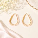 Rose Gold Pearl Hoop Earrings with teardrop design on elegant background